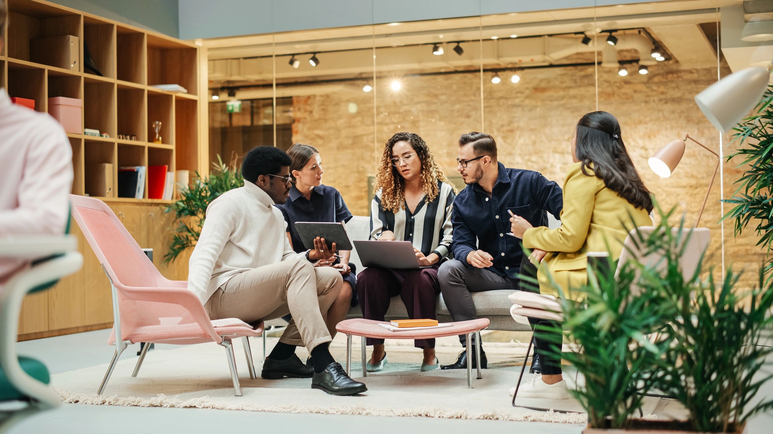 Technology team collaborating in a modern office meeting room